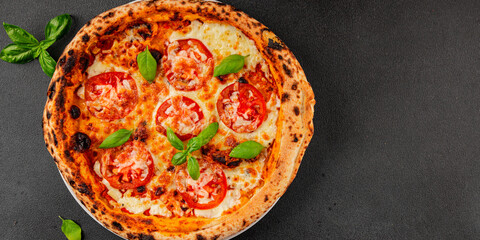 Pizza tomato margarita fast food natural product tasty snack fresh delicious gourmet food background on the table rustic top view copy space