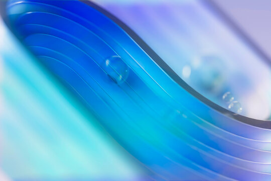 Curved waves on abstract blue surface. 3D visual ripple.