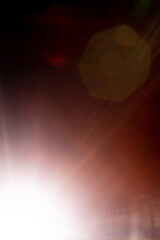 Blurred image Sun flare on the black background