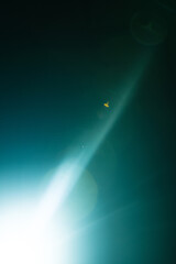 Flash of a distant abstract star. Abstract sun flare. The lens flare is subject to digital correction.