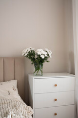 A Serene Bedroom Featuring Beautiful Floral Decor and Soft, Cozy Textiles for Comfort