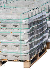 The pallet with a stack of concrete curbstone on white