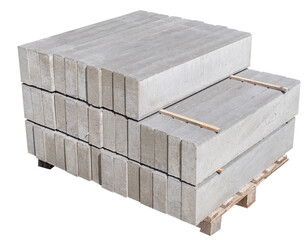 The pallet with a stack of concrete curbstone on white