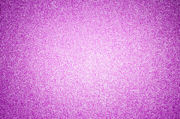 Glitter as a background in purple with a vignette.