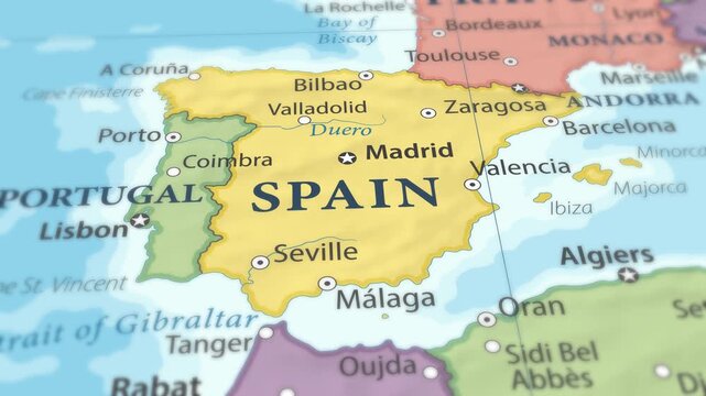 4K macro footage of Spain on a world map with shallow depth of field. Focus on word Spain and nearby regions. Travel geography footage