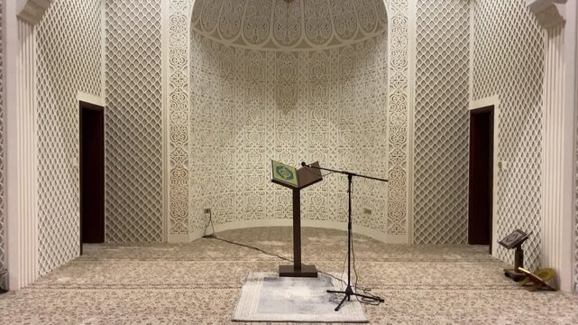 Tilt down Shot of the Holy Quran near mihrab Inside a Mosque - HD