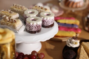 Buffet menu. Different delicious desserts on table, selective focus