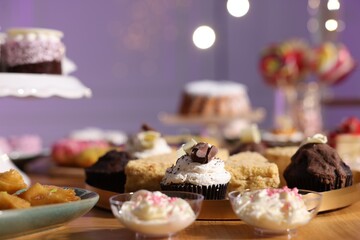 Buffet menu. Different delicious desserts on table, selective focus