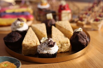 Buffet menu. Different delicious desserts on table, selective focus