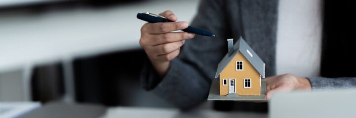 banker assesses home loan terms and contract finance in office