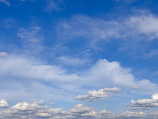 Scattered Cumulus Clouds above Deep Blue Sky