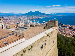 Naples, Italy - aerial view of the castle of San Telmo, the city and the volcano Vesuvius in the background