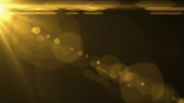 Abstract golden light gracefully dances against a darkened backdrop, creating a mesmerizing visual of radiant energy and a sense of warmth, a representation of ethereal beauty.
