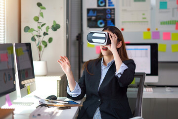 Woman wearing VR headset, experiencing virtual reality and interacting with digital data in a modern workplace setting