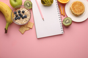 Making a meal plan for several days. Concept of healthy lifestyle, sports and daily routine. Notebook, marker, dumbbells, fruit healthy food, centimetre. Diet plan. Top view, horizontal.