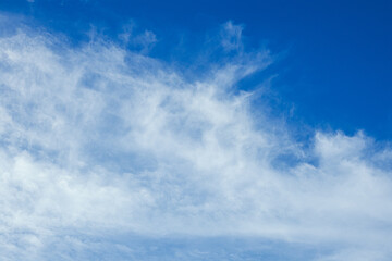 Wispy White Clouds in a Blue Sky