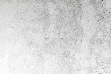 A grungy white concrete surface with speckled patterns and subtle tonal variation