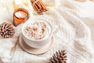 Cozy winter or Christmas template with coffee (Eggnog Latte) and candle
