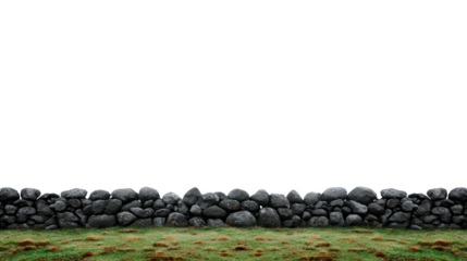 Stone wall with rough texture stands on green grass field, creating rustic and natural outdoor scene, evoking peaceful countryside atmosphere