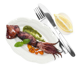 Tasty cooked squid with sauce, tomatoes, cutlery and basil isolated on white, top view