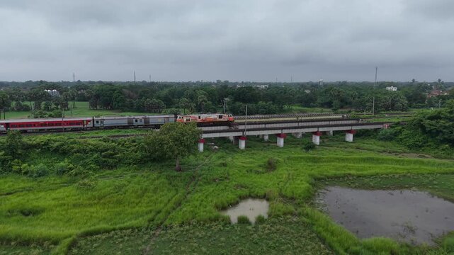 4K Drone Footage of Indian Train Moving on Tracks | Aerial View of Indian Railways Through Scenic Landscape