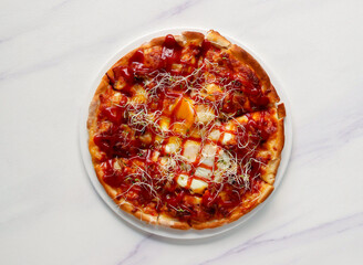 Moon Pizza with Eggs, Ketchup, and Sprouts on a White Plate on marble background Top View of italian food