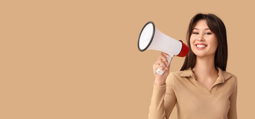Smiling young woman with megaphone on beige background with space for text