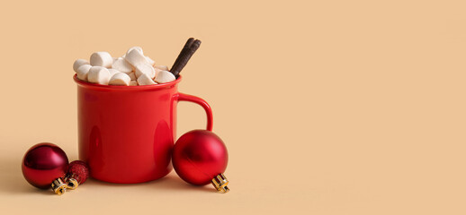 Cup of hot cocoa with marshmallows and Christmas balls on yellow background