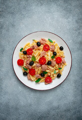 Tuna salad, fusilli pasta, olives and cherry, olive oil, homemade,