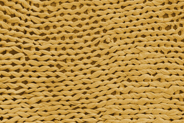 Macro, close up, detailed yellow knitted textile, fabric texture with chunky yarn pattern suface. Cozy handmade cloth background, knitwear backdrop , perfect for design, crafts, warm winter concept