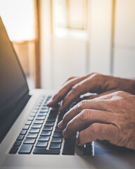 Man writing with laptop. Closeup of hands typing on keyboard. Technology, business, work, concept.