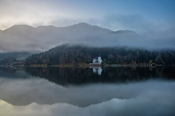 The beautiful mountain lake Grundlsee at the southern foot of the Totes Gebirge mountains in the Styrian part of the Salzkammergut in Austria