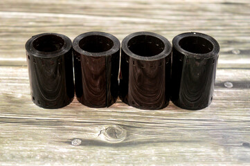 rolls of photographic film, a strip of transparent plastic film coated with a light sensitive emulsion, that forms a latent image when exposed to light, then chemically developed to create photograph