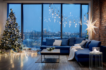 A stylish modern loft decorated for Christmas: app-controlled LED string lights, personalized wooden ornaments engraved with names, minimalist Scandinavian furniture in cool tones, and large windows