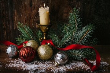 Vintage metallic Christmas decorations with ribbon and candlelight
