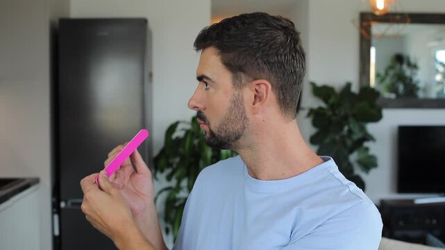 Man gossiping while doing his nails 