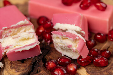 pomegranate and sweet curd cheese in pink glaze, sweet red pomegranate seeds and curd sweet products