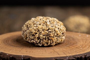 halved sweet marshmallows in chocolate sprinkled with waffle crumbs, sweet dessert marshmallows in milk chocolate with crumbs