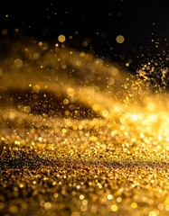 Shimmering gold dust particles illuminated against a dark background