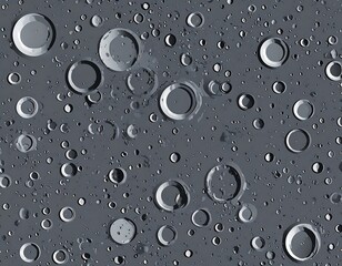 Textured dark grey background with numerous circular impact craters