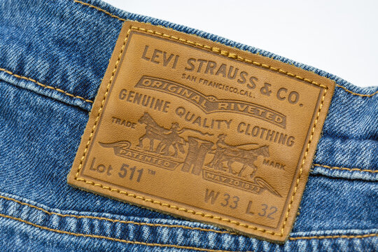 Pair of Levi's 511 jeans closeup on white.