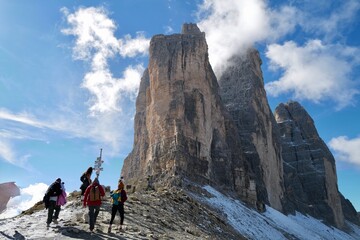 hiker in the mountains at the tree peaks (die Drei Zinnen) in northern Italy