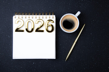 New year goals 2026 on desk. 2026 resolutions list with notebook on black table. Resolutions, plan, goals, action, checklist, idea concept. New Year 2026 resolutions, copy space
