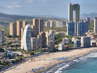 Captivating Aerial View of a Modern Coastal City Featuring Its Beach and Iconic Skyscrapers