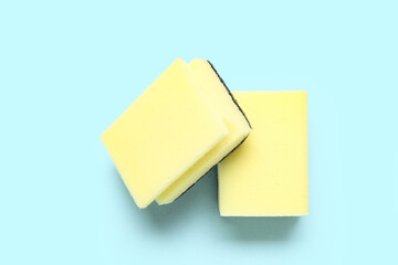 Cleaning sponges on blue background