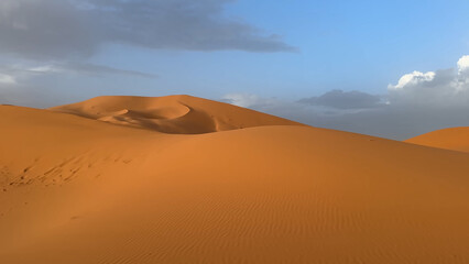 A trip to Sahara desert in Morocco. Beautiful 
african travel photo. Sandy landscapes, 
dunes, and nature. Summer vacation in arab country.