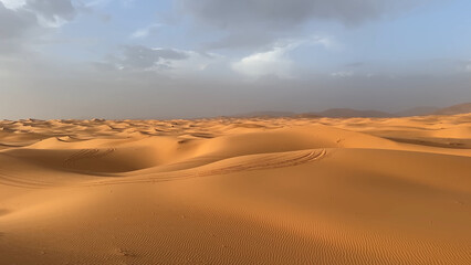 A trip to Sahara desert in Morocco. Beautiful 
african travel photo. Sandy landscapes, 
dunes, and nature. Summer vacation in arab country.