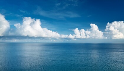 Beautiful White Clouds On Blue Sky Over Calm Sea Background