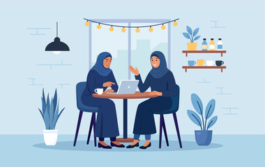 Muslim business meeting. Women in national costumes are discussing project in cafe. Startup presentation. Business consultation, deal talk. Arab friends working, studying together in co-working space