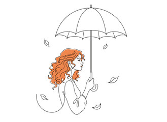 Young red-haired girl with an umbrella is listening to autumn music